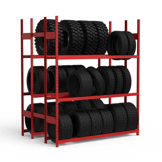 Red metal tire rack with black tires on a white background